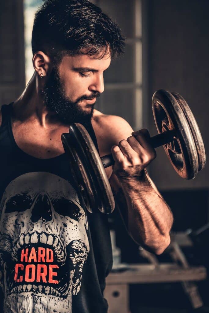 man holding dumbbell